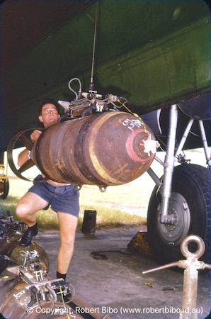 Hoisting bombs into position.