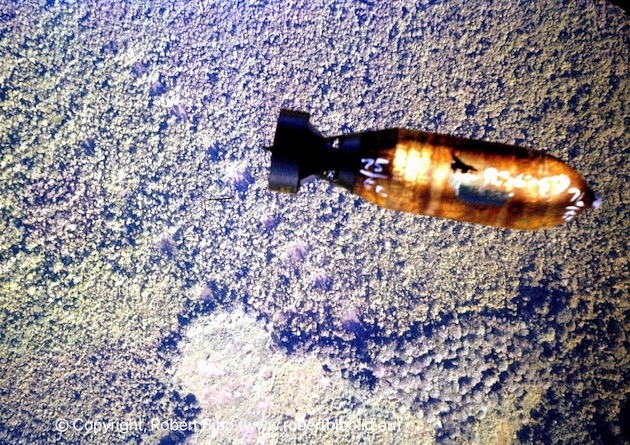 A bomb falling as seen from the bomb bay.