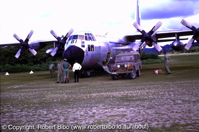 A C130E and land Rover Series 1 at Vanimo PNG.